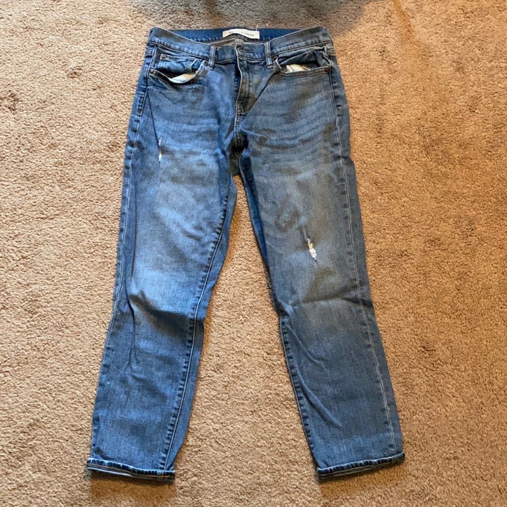 Light wash distressed girlfriend jeans